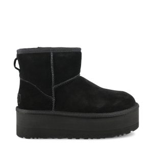 Stivali Classic Mini con plateau in pelle scamosciata.