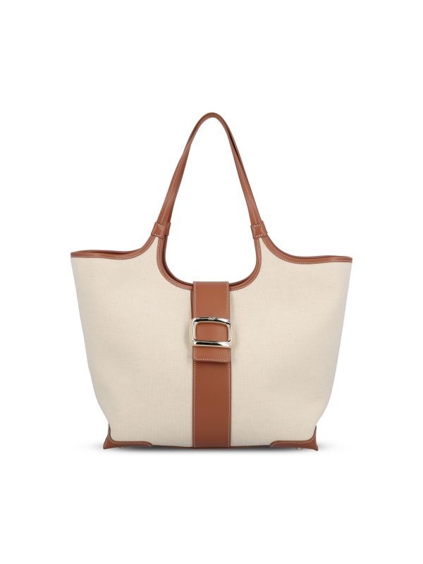 Borsa realizzata in tessuto e pelle.