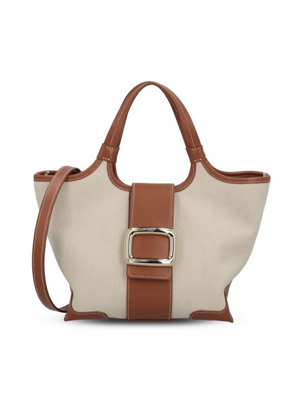 Borsa realizzata in tessuto e pelle.