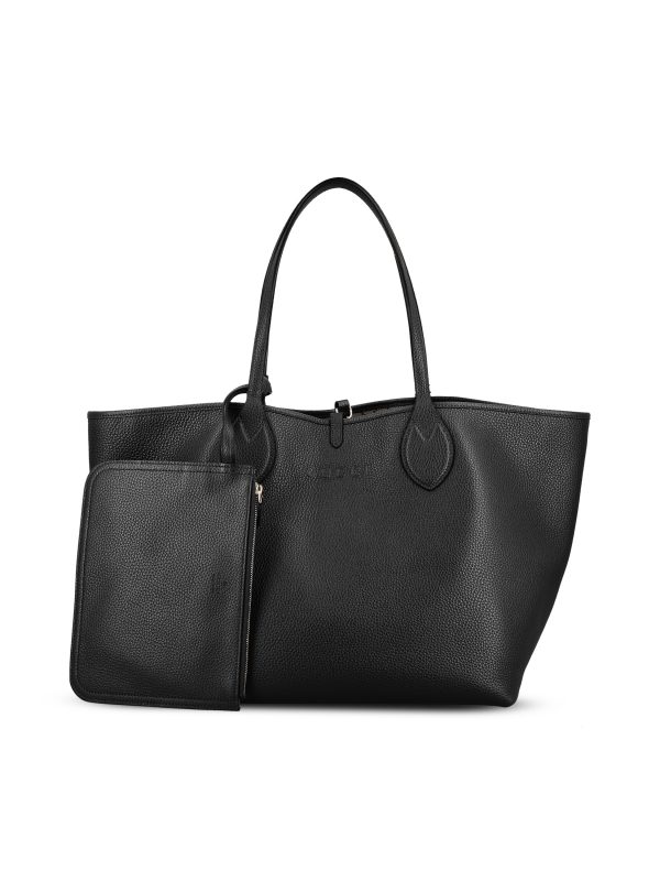 Borsa realizzata in pelle e tessuto.